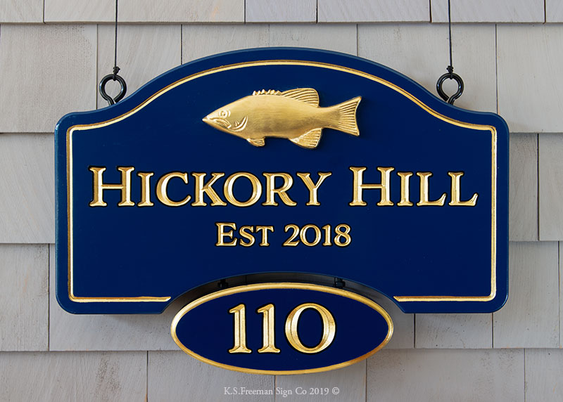 Carved custom house sign with carved fish